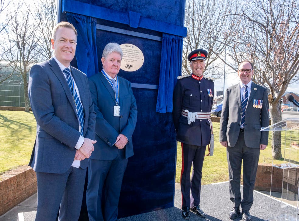 (l to r) Babcock programme director Grant Steven, production engineer Alf Ramsay, Lord Lieutenant of Fife Robert Balfour and Mark Beverstock, Rear Admiral, retired, standing in front of the plaque dedicated to Babcock employees who prepared ships for battle in the Falklands War (Peter Devlin/PA)
