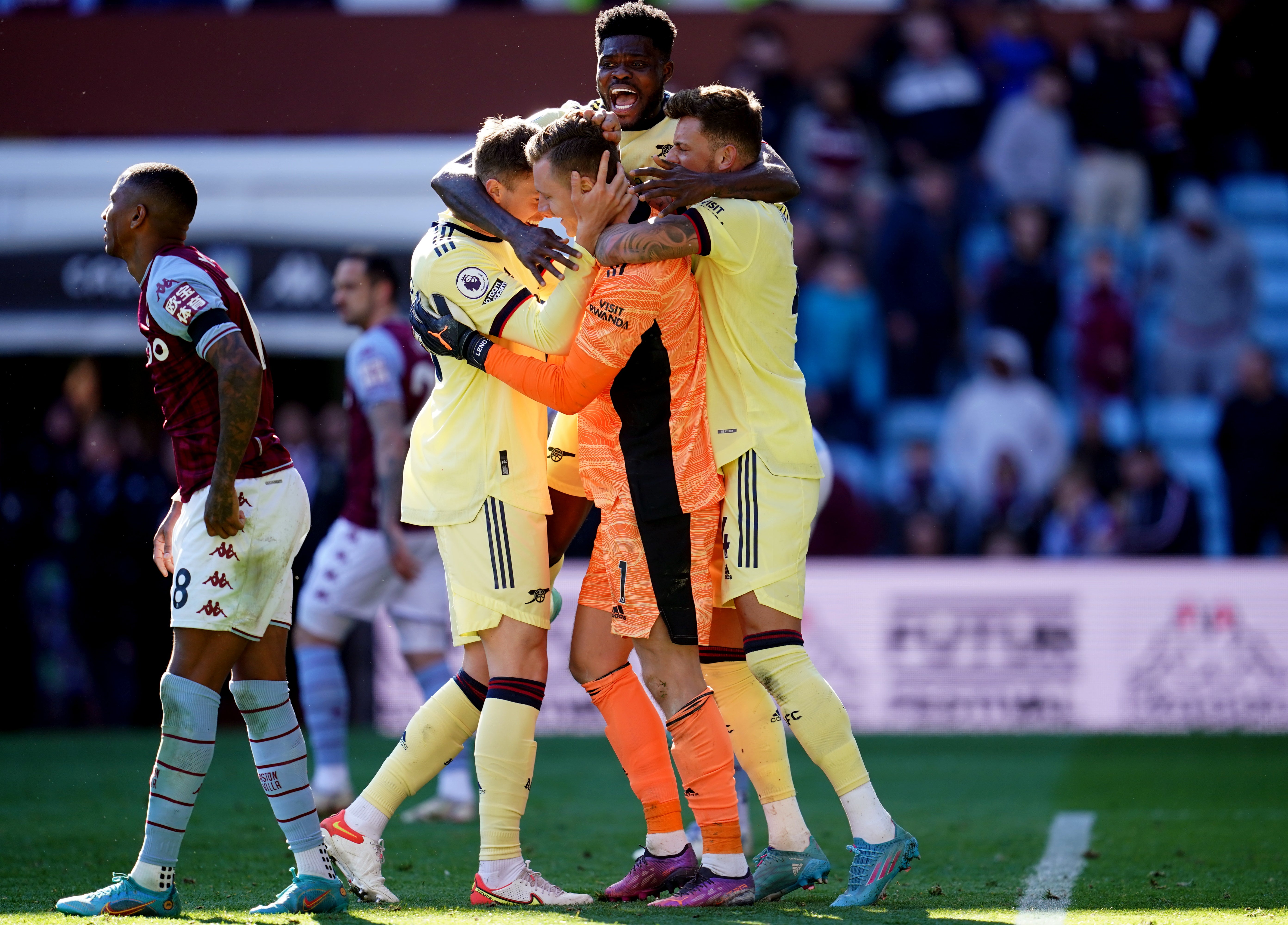 Arsenal goalkeeper Bernd Leno celebrates with Thomas Partey, Ben White, right, and Rob Holding, left, after making a save in the closing stages against Aston Villa (Nick Potts/PA)