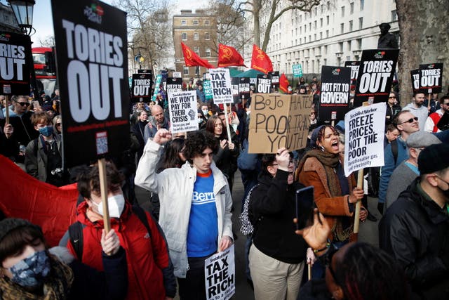 People protest against the rising cost of living outside Downing Street in London