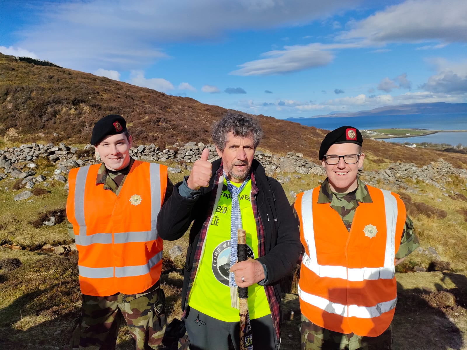 Charlie Bird, centre, poses with members of the Defence Forces on Croagh Patrick (Paul Allen and Associates/PA)