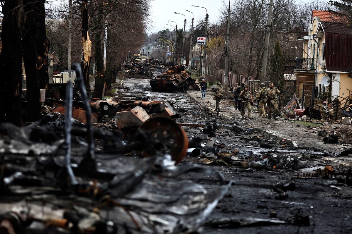 ‘Pure brutality’: Ukraine finds half-burned civilians in mass graves shot in ‘back of their heads’ | The Independent