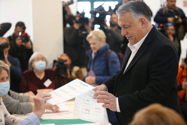 <p>Hungarian prime minister Viktor Orban prepares to cast his ballot during the elections at a polling station in Budapest, 3 April 2022</p>