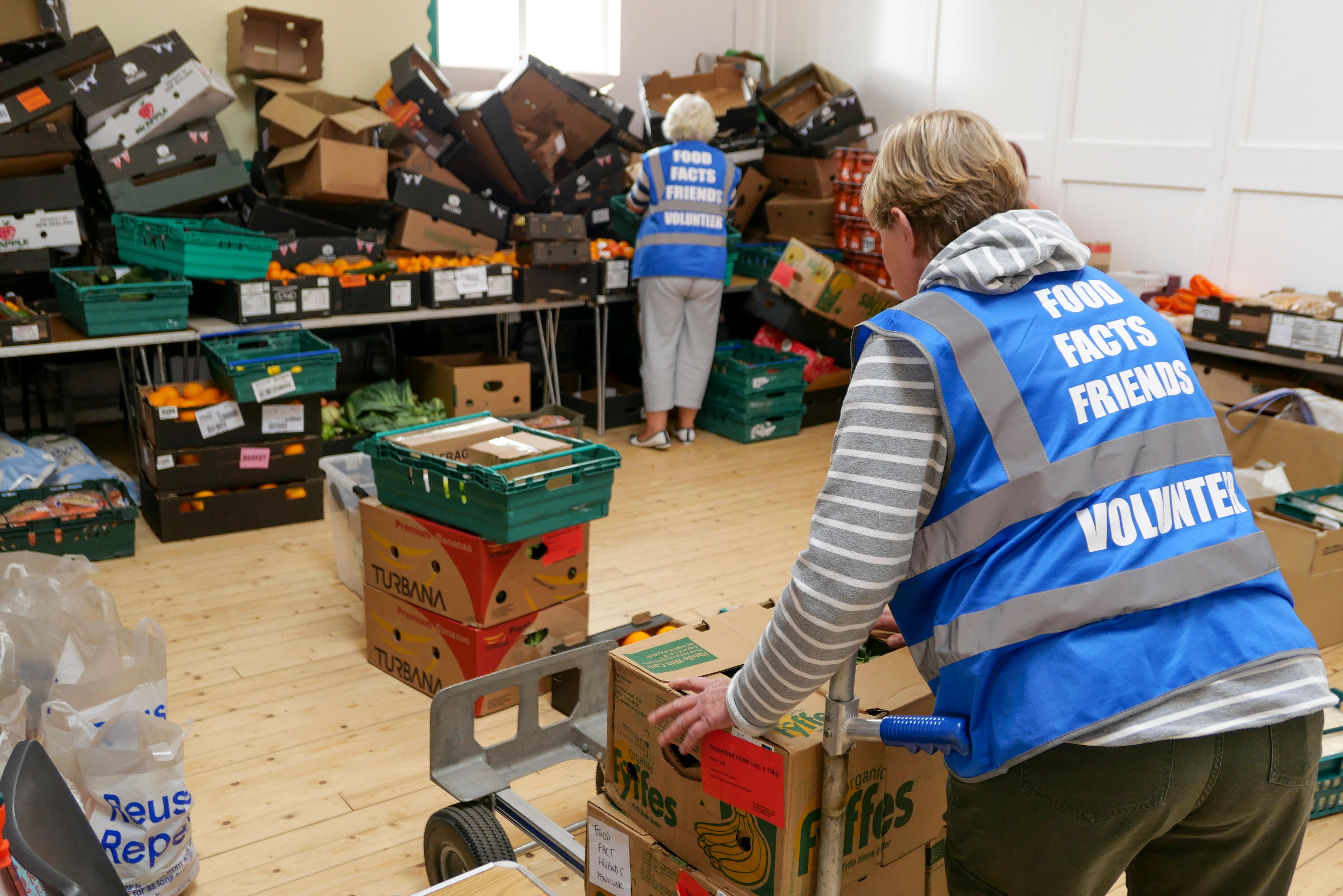 Food bank volunteers unpacking food in Penicuik, Scotland