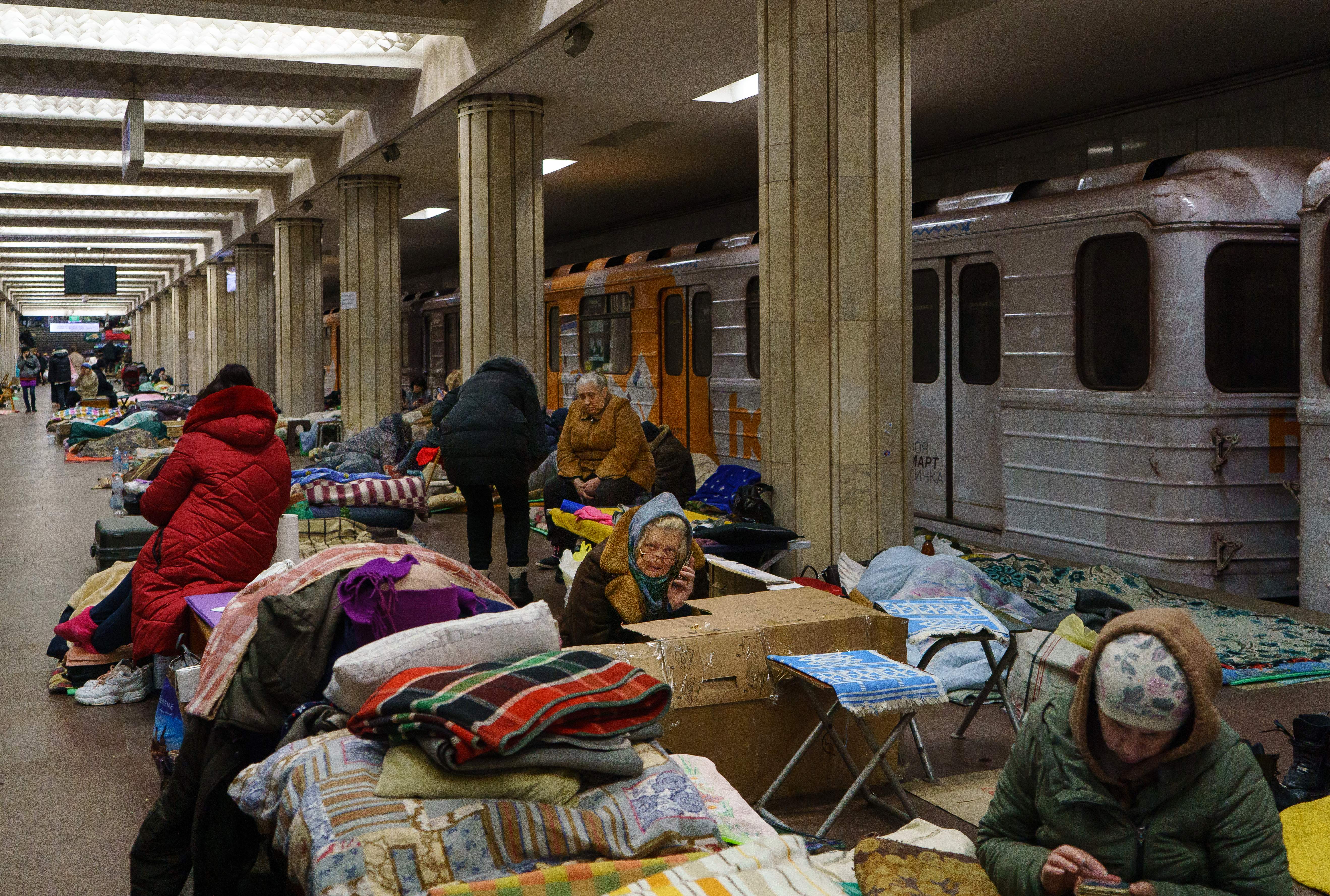 Kharkiv residents rest as they shelter from attacks in a metro station, 10 March 2022