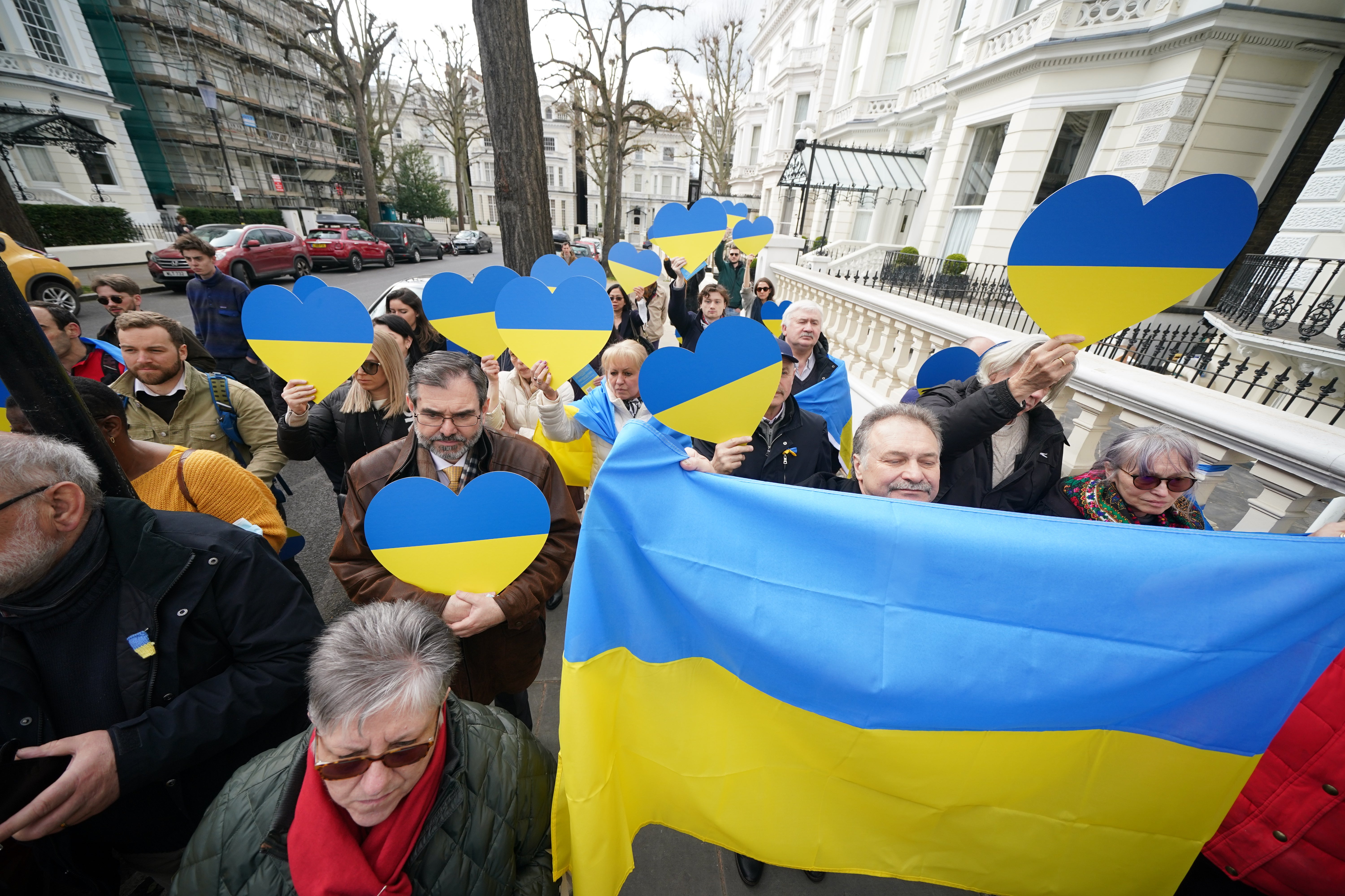 Members of the public join church leaders leading a crowd in an act of witness outside the Ukrainian embassy in Holland Park, west London (Yui Mok/PA)
