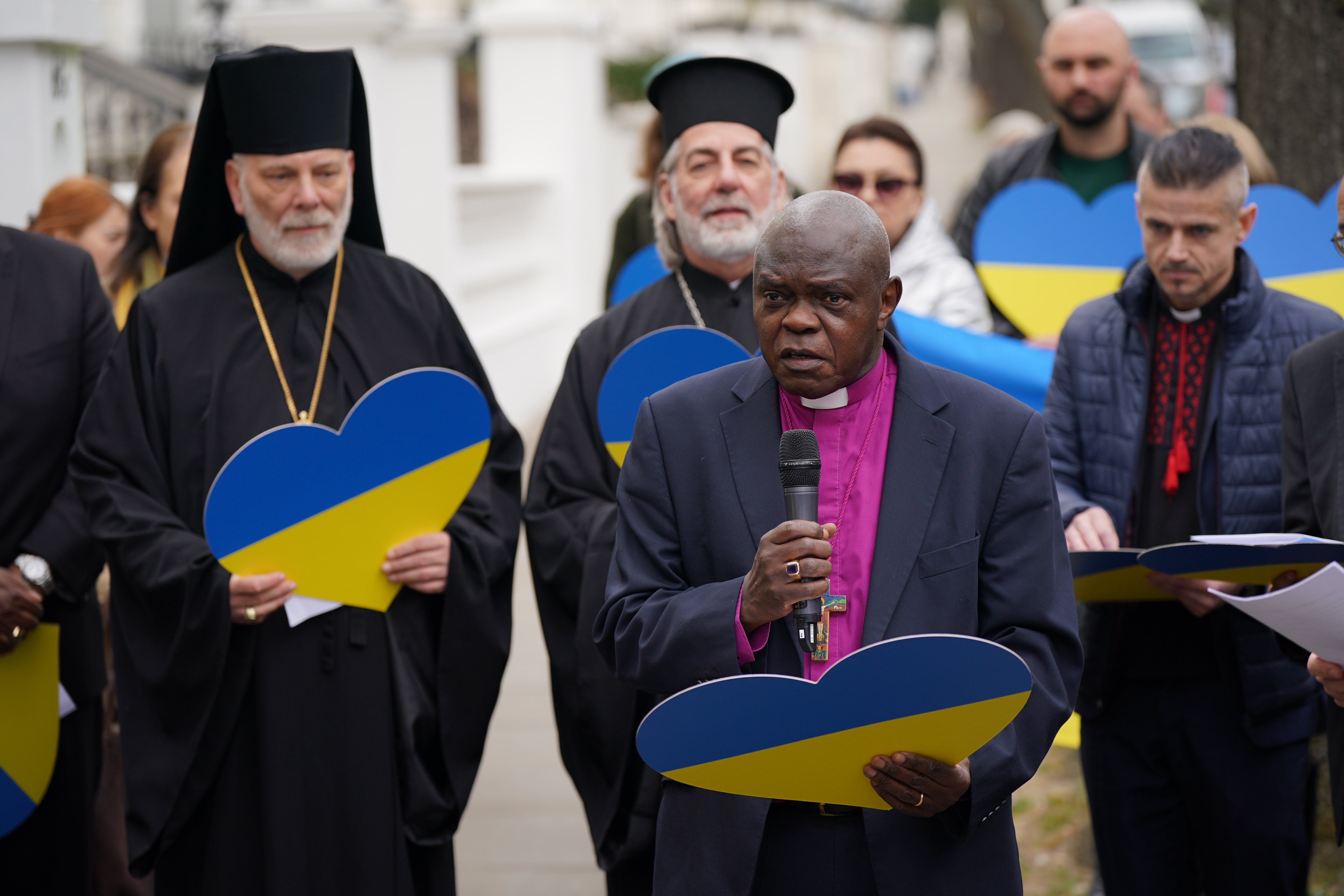 Chairman of Christian Aid and former archbishop of York, John Sentamu, joins other church leaders leading a crowd in an act of witness outside the Ukrainian embassy in Holland Park (Yui Mok/PA)