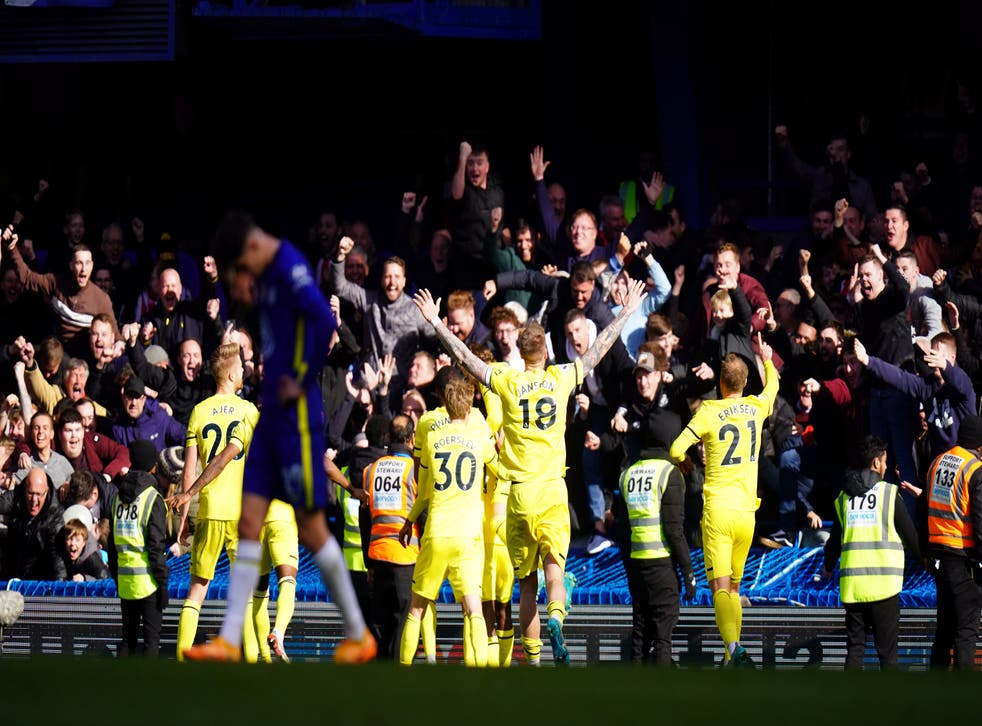 Brentford players celebrate in front of their fans after beating Chelsea 4-1 at Stamford Bridge (Adam Davy/PA)