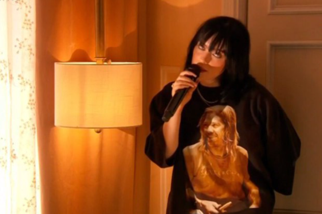 <p>Billie Eilish wearing a Taylor Hawkins T-shirt during her Grammys performance</p>