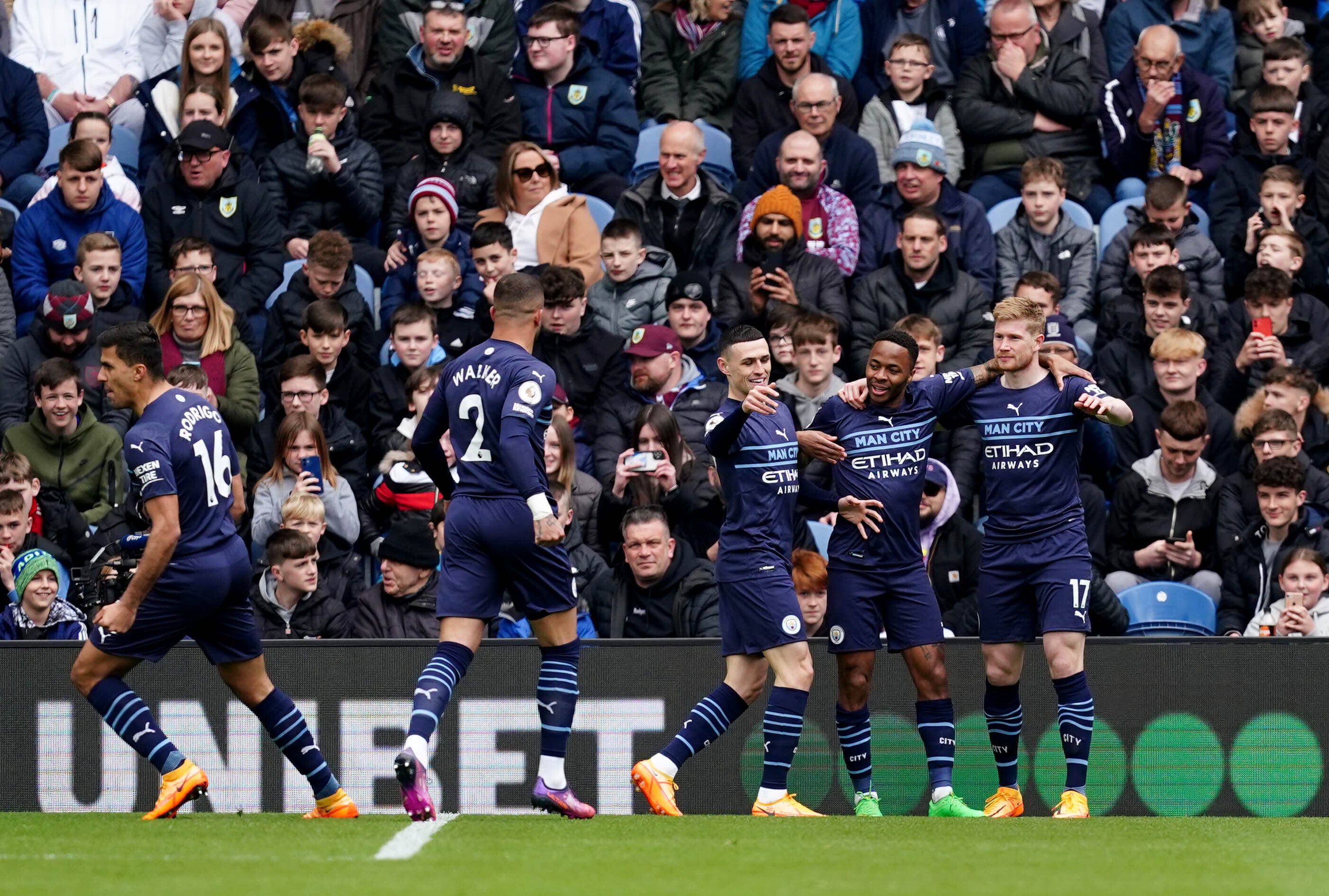Manchester City beat Burnley 2-0 to remain a point clear (Martin Rickett/PA)