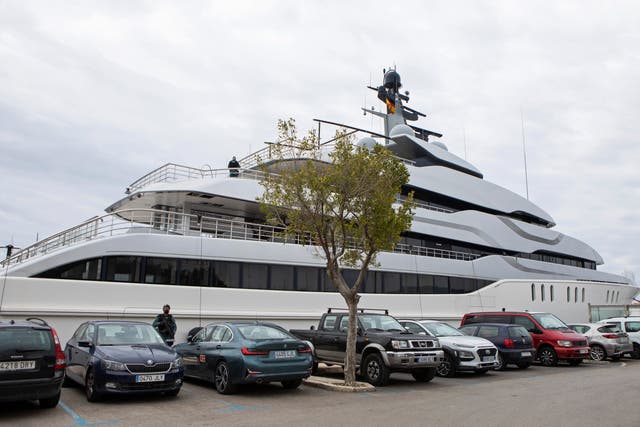 <p>A Civil Guard stands by the yacht called Tango in Palma de Mallorca, Spain</p>