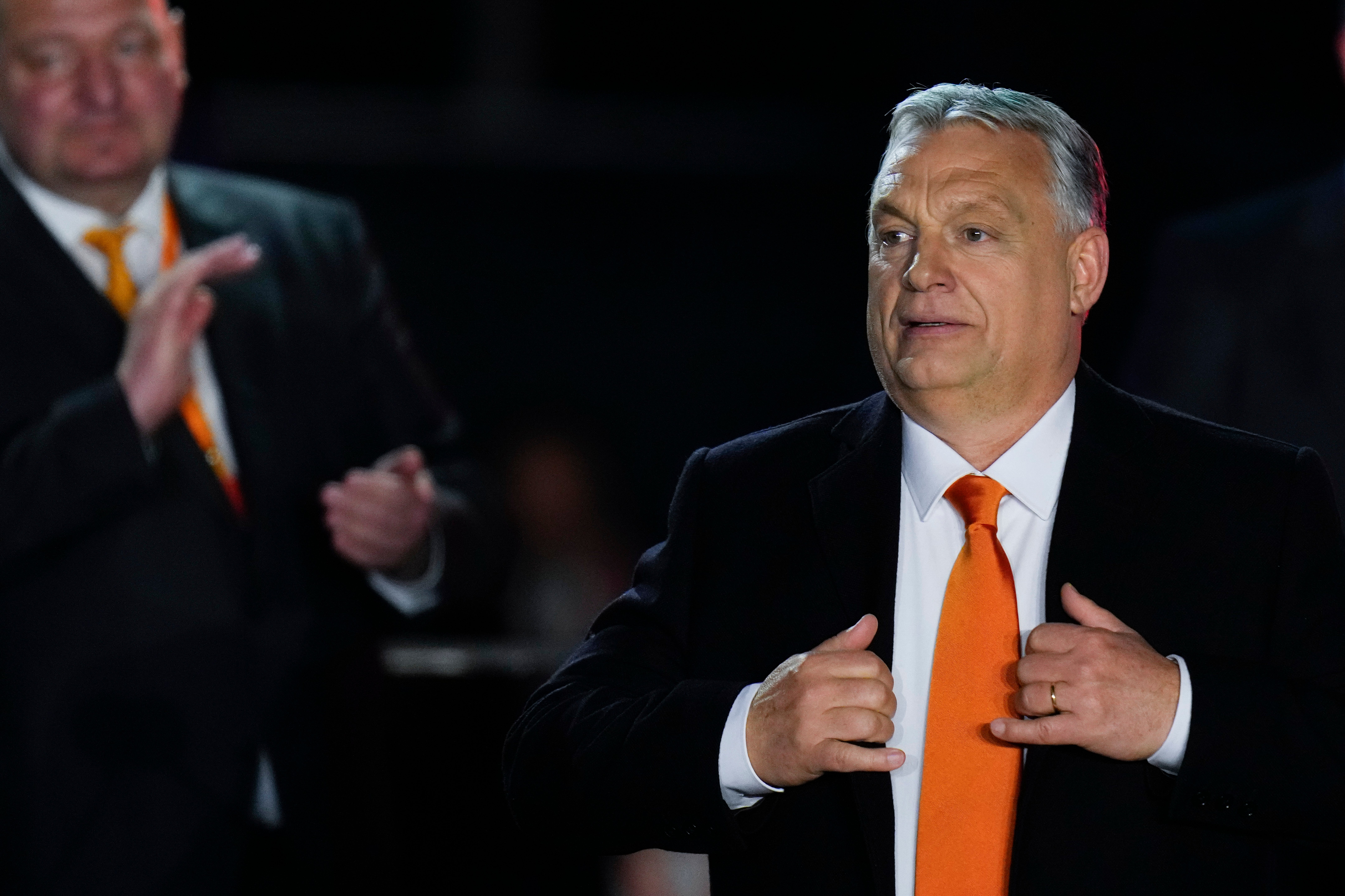 Viktor Orban acknowledges cheering supporters in Budapest on Sunday night