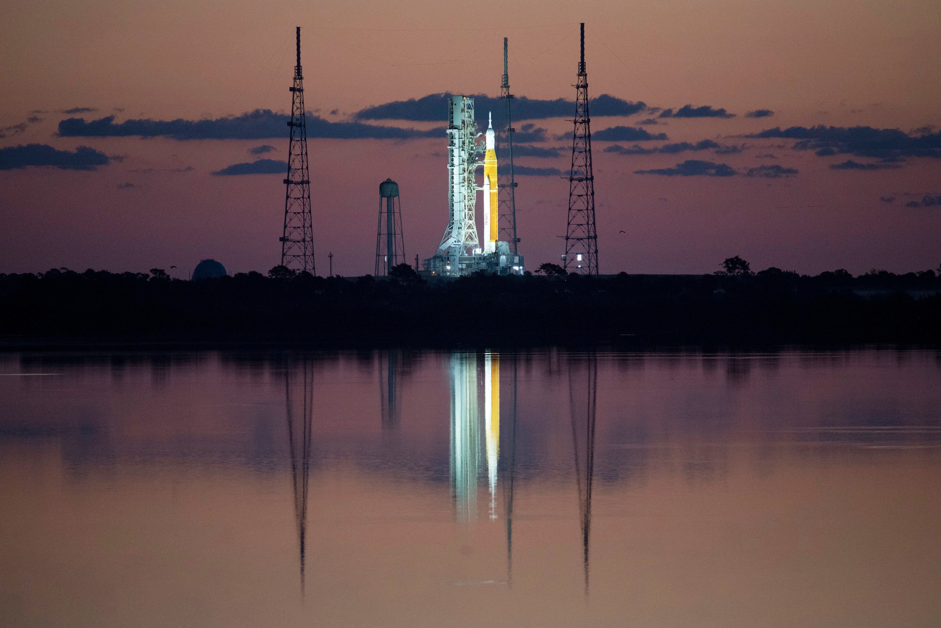 In this handout photo provided by NASA, NASA's Space Launch System (SLS) rocket with the Orion spacecraft aboard is seen at sunrise atop a mobile launcher at Launch Complex 39B on April 4, 2022 at the Kennedy Space Center in Cape Canaveral, Florida