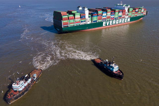 <p>The tugboats Atlantic Enterprise, bottom left, and Atlantic Salvor, bottom right, use lines to pull the container ship Ever Forward, which ran aground in the Chesapeake Bay, as crews began to attempt to refloat the ship, Tuesday, March 29, 2022, in Pasadena, Md. (AP Photo/Julio Cortez)</p>