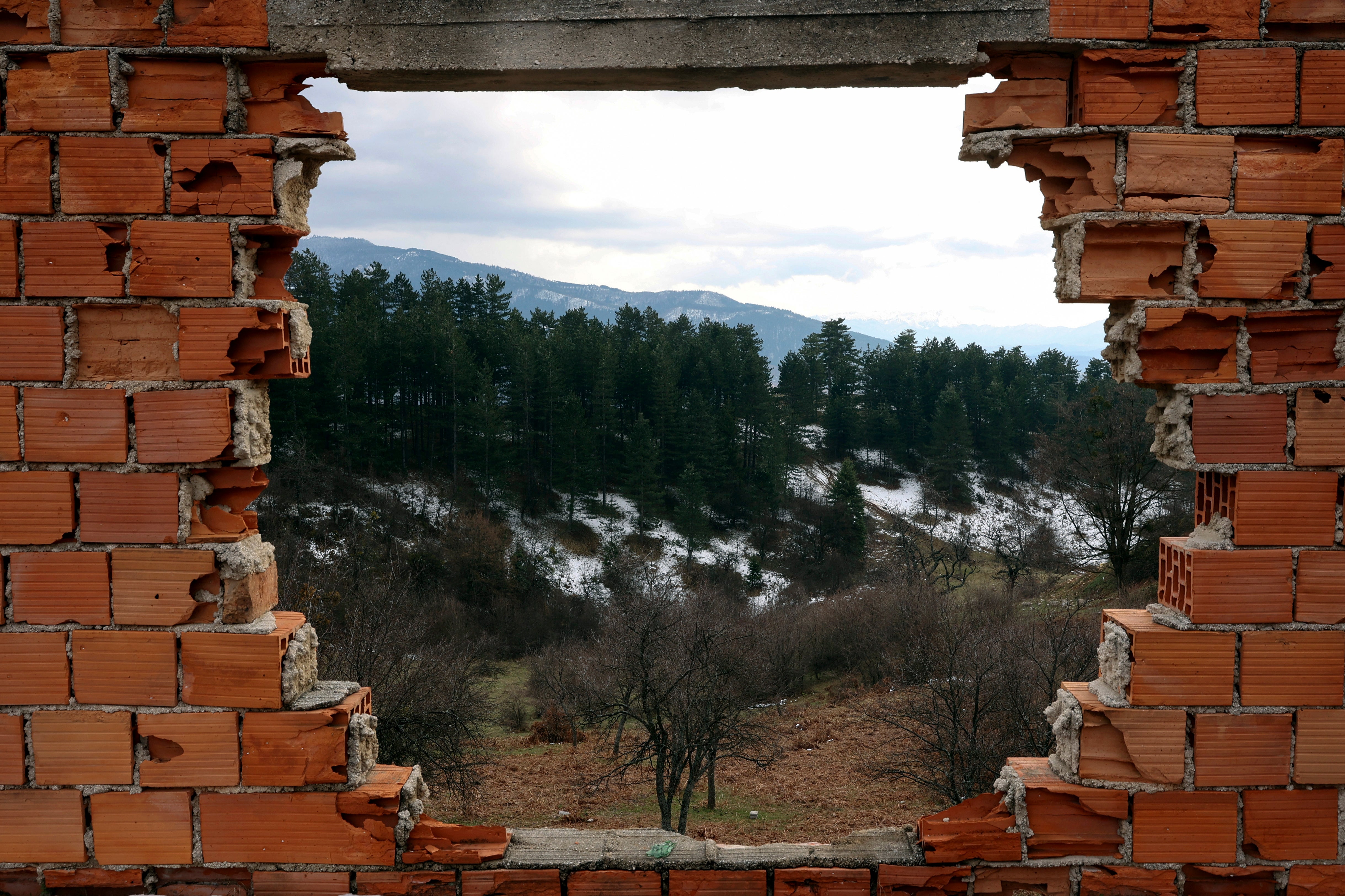 <p>A view of a former front-line from a ruined house from 1992-1995 war is seen in Sarajevo, Bosnia, Monday, April 4, 2022</p>