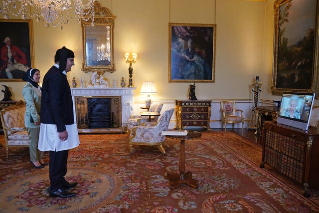 The Queen appears on screen during a virtual audience with Libyan Ambassador Salah Mrehil and his wife, Hanaa Gbasa (Yui Mok/PA)