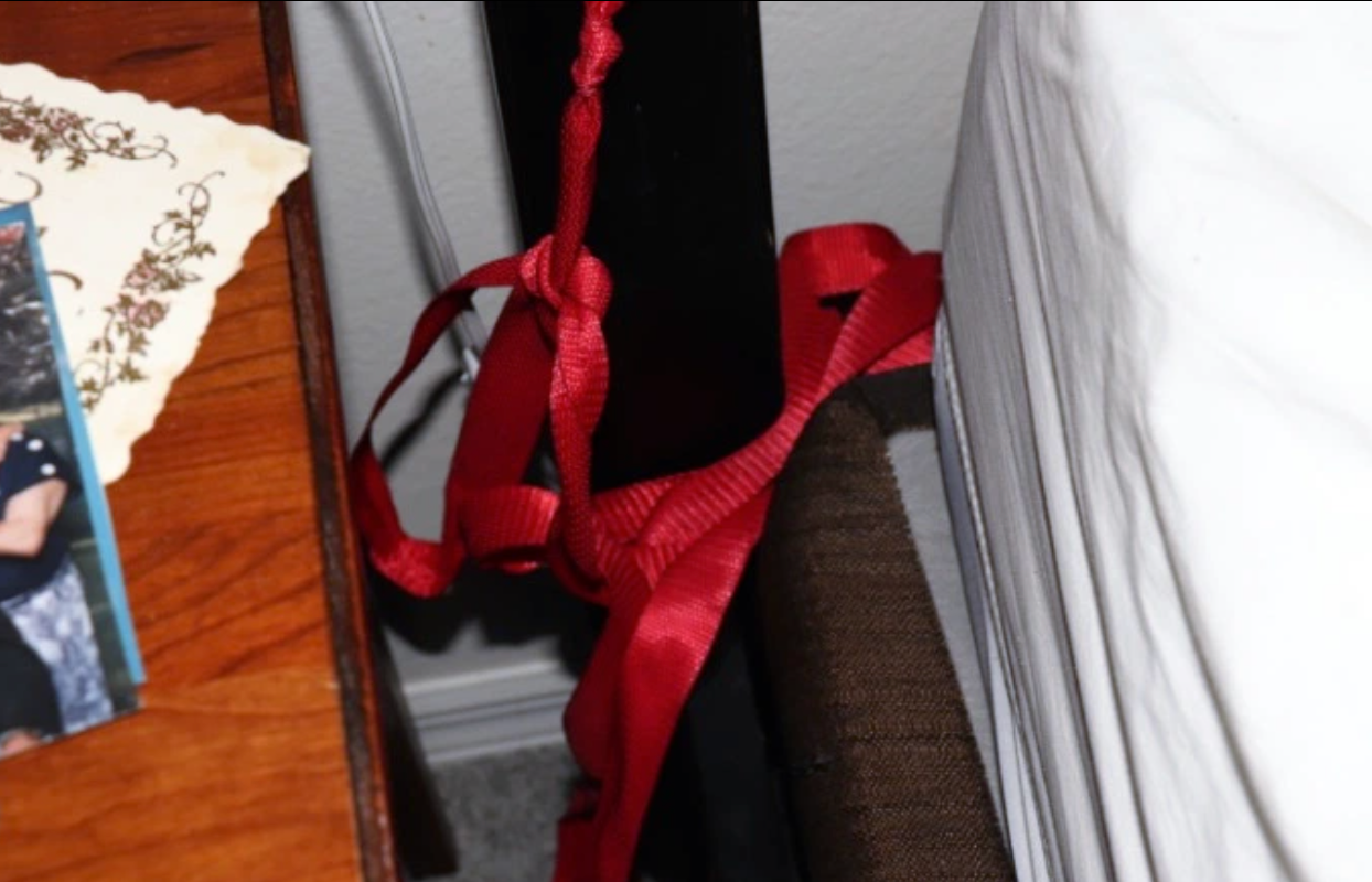 A makeshift restraint is seen on the side of the bed where Anthony Todt allegedly killed his family