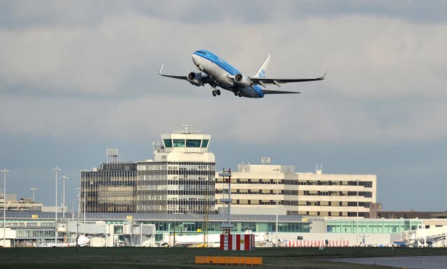 <p>A KLM Boeing 737-800 takes off from Manchester Airport. (Martin Rickett/PA)</p>