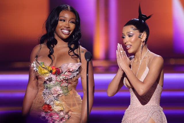 <p>SZA onstage at the Grammys with Doja Cat</p>