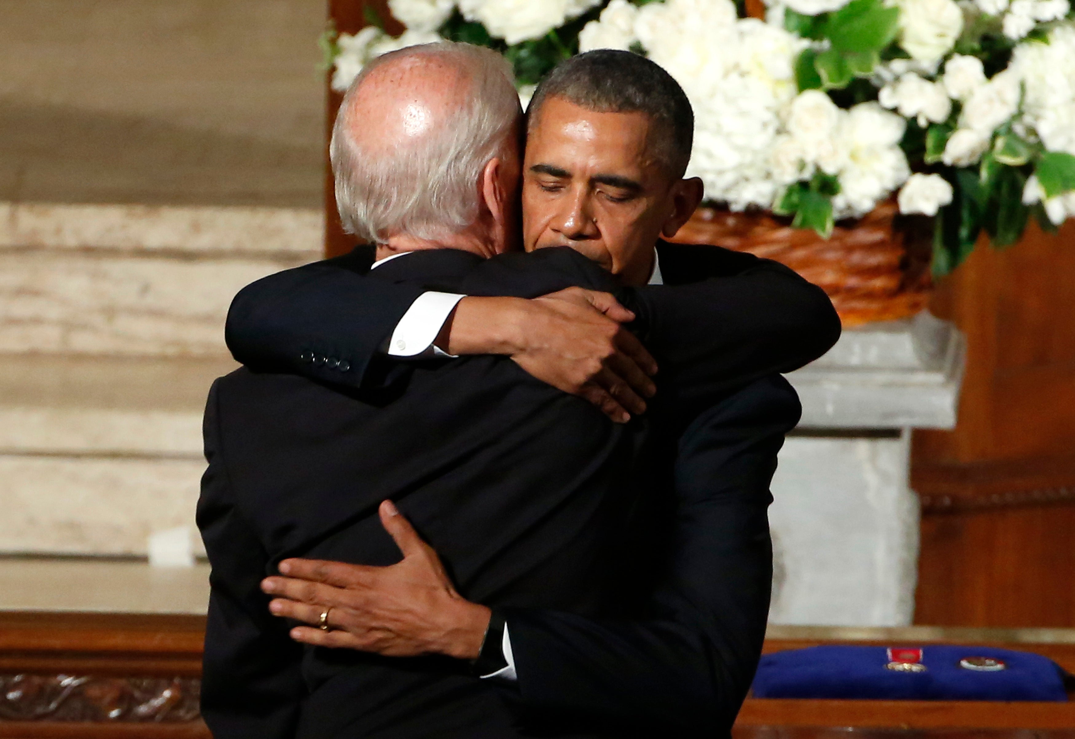 President Barack Obama hugs Vice President Joe Biden during the funeral of Beau Biden on June 6, 2015