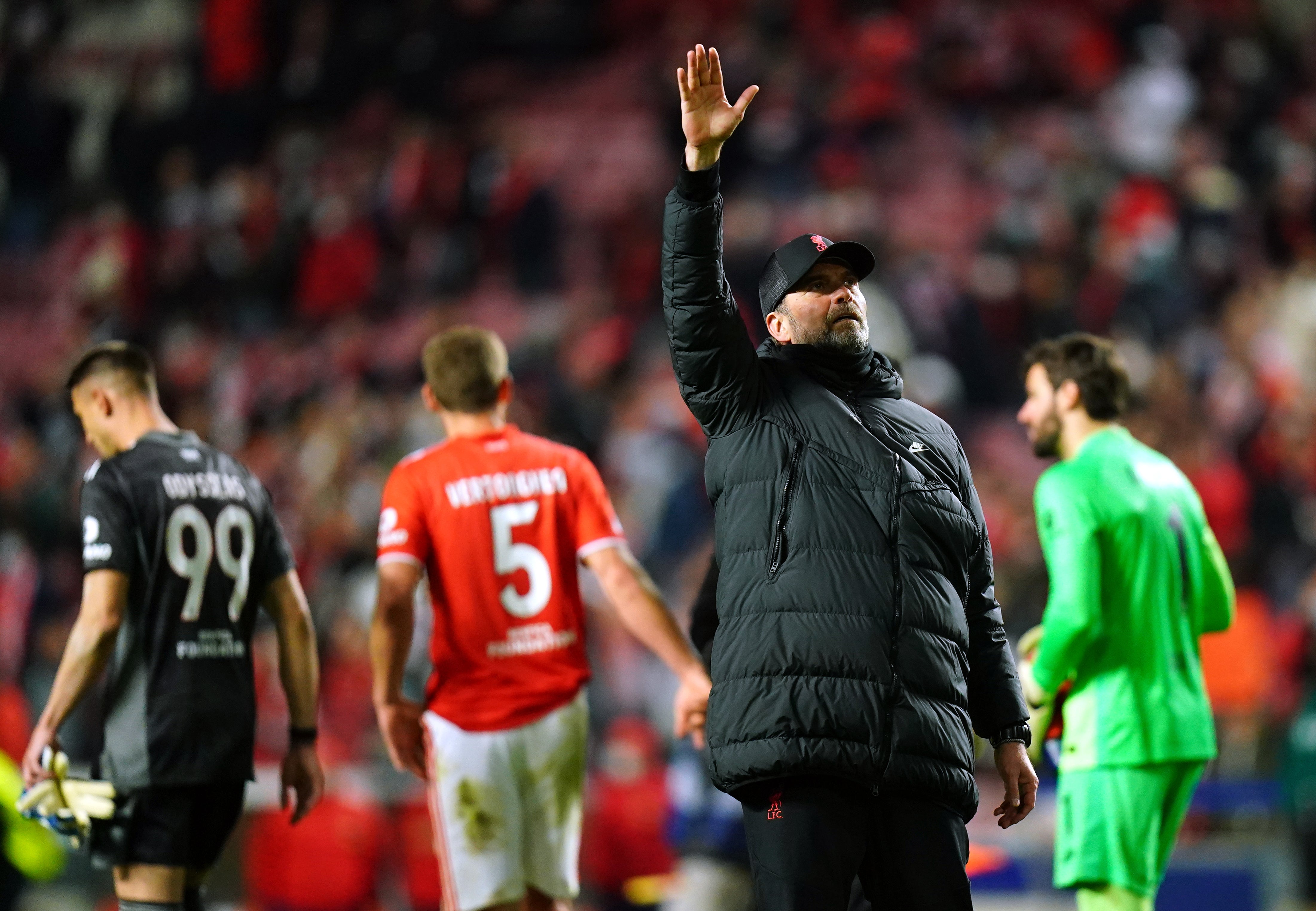Jurgen Klopp salutes the fans after victory over Benfica (Adam Davy/PA)