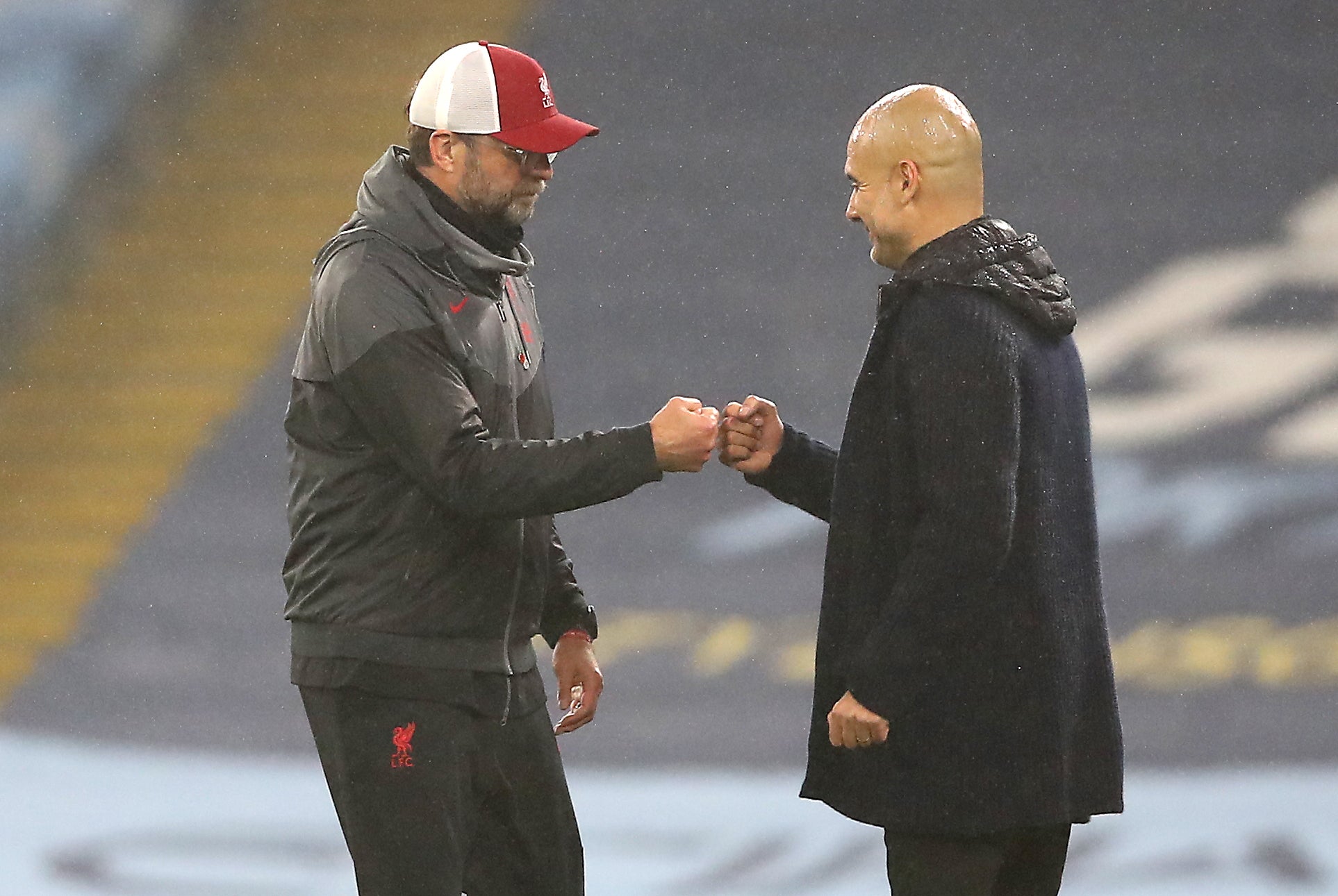 Liverpool manager Jurgen Klopp, left, and Manchester City boss Pep Guardiola go head to head this weekend (Martin Rickett/PA)