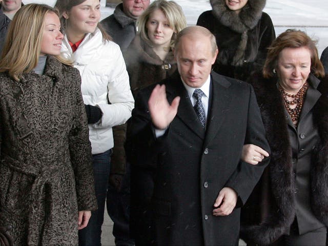 <p>Russian president Vladimir Putin, with his ex-wife Ludmila and their daughter Maria (left) at a Moscow polling station in December 2007</p>