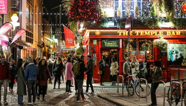 People out socialising in Temple Bar in Dublin city, a popular spot for tourists (Damien Storan/PA)