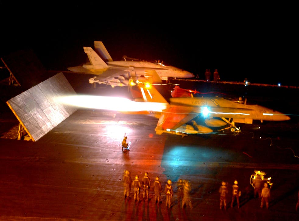 <p>Two US combat jets launch as part of Operation Iraqi Freedom, as the shock and awe campaign begins, 21 March 2003    </p>