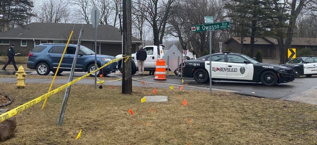 <p>Authorities investigate the scene of a fatal shooting in Roseville, Minn. last month </p>