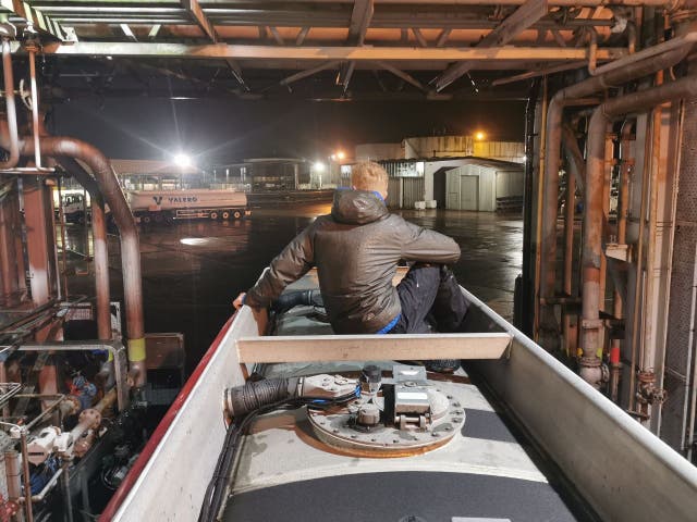 <p>A protester sits atop a tanker at the Kingsbury Oil Terminal</p>