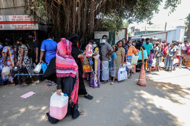 <p>People wait to buy kerosene at a gas station amid a fuel shortage in Colombo, Sri Lanka </p>