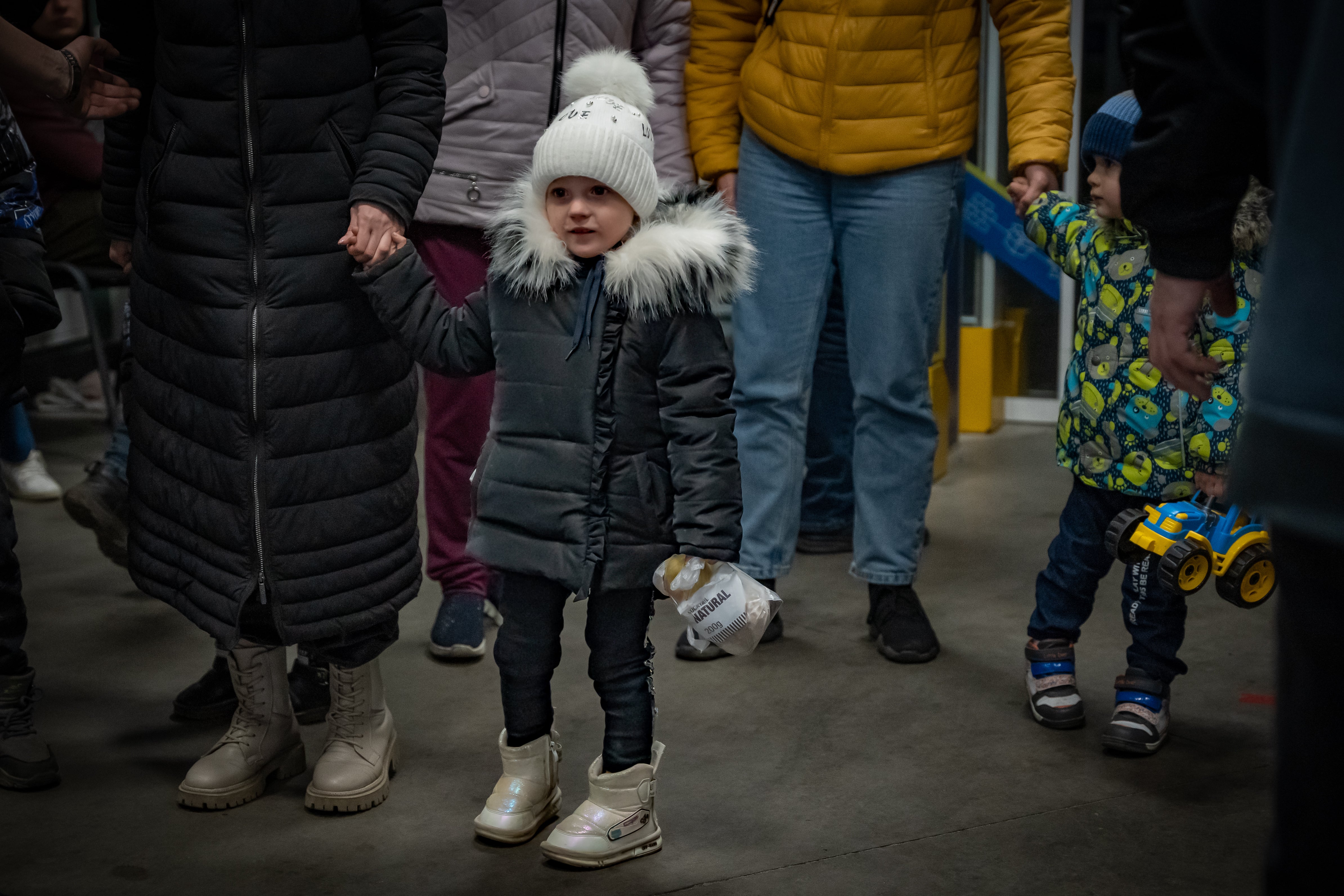 A small child arrives in a reception centre in Zaporizhzhia after weeks trapped underground in Mariupol