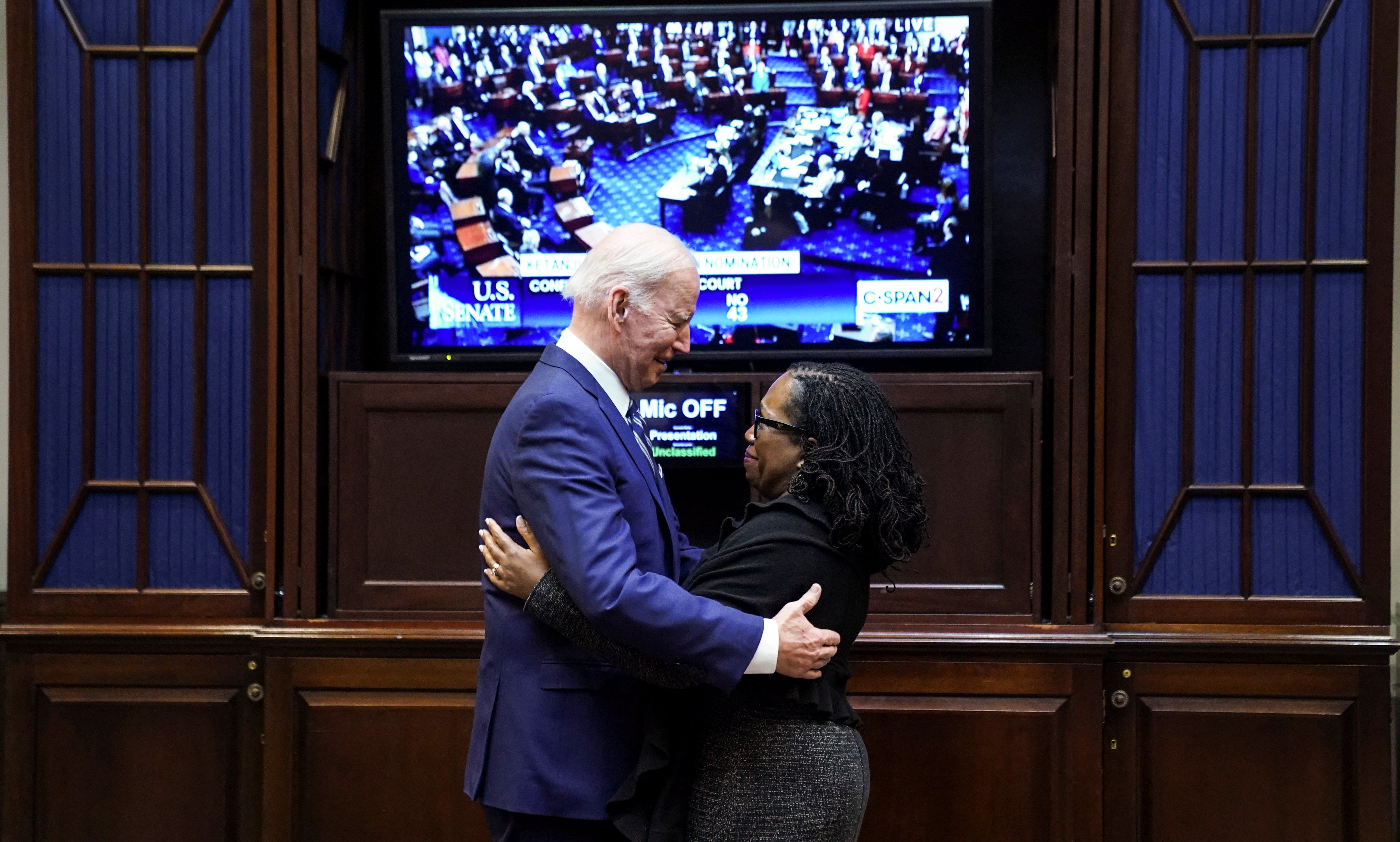 <p>Joe Biden stands with Judge Ketanji Brown Jackson as they watch the full Senate vote on Jackson's nomination to the US Supreme Court, from the Roosevelt Room at the White House on Thursday </p>