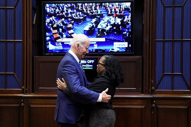 <p>Joe Biden stands with Judge Ketanji Brown Jackson as they watch the full Senate vote on Jackson's nomination to the US Supreme Court, from the Roosevelt Room at the White House on Thursday </p>