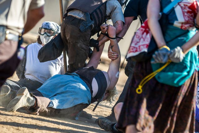 <p>Police in riot gear arrest environmental activists at the Line 3 pipeline pumping station near the Itasca State Park, Minnesota on June 7, 2021. </p>