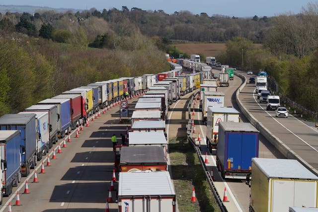 <p>Lorries queued in Operation Brock on the M20 in Kent  on Thursday </p>