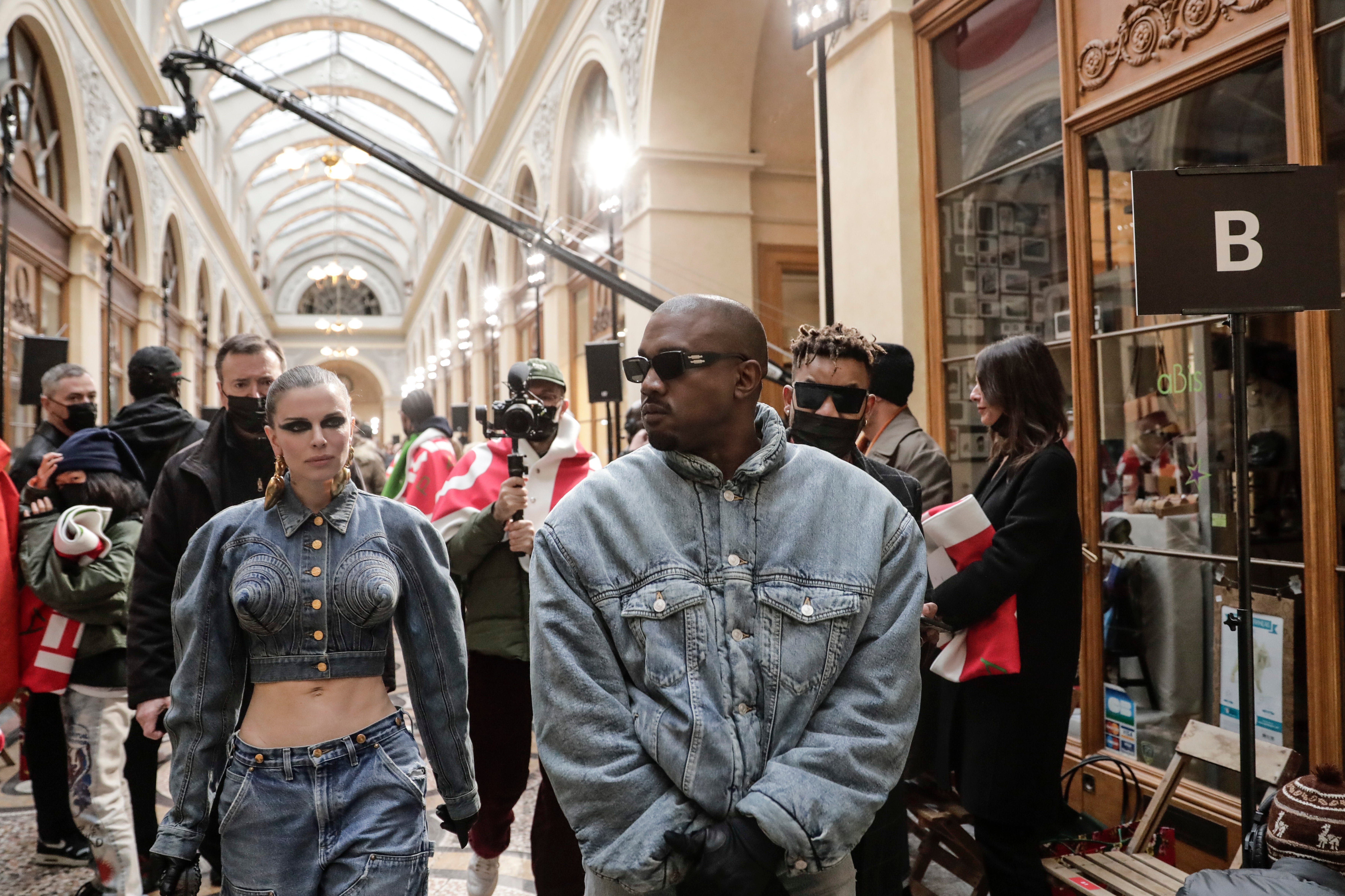 Kanye West and Julia Fox at the Kenzo menswear show (Lewis Joly/AP)