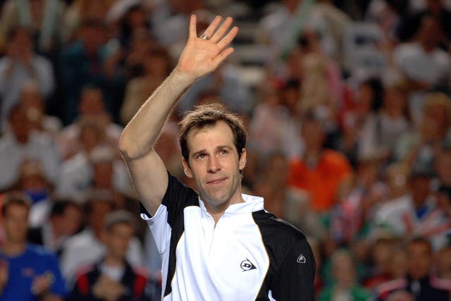 Greg Rusedski waves to the crowd after announcing his retirement at the end of his Davis Cup doubles match in Birmingham (Anna Gowthorpe/PA)