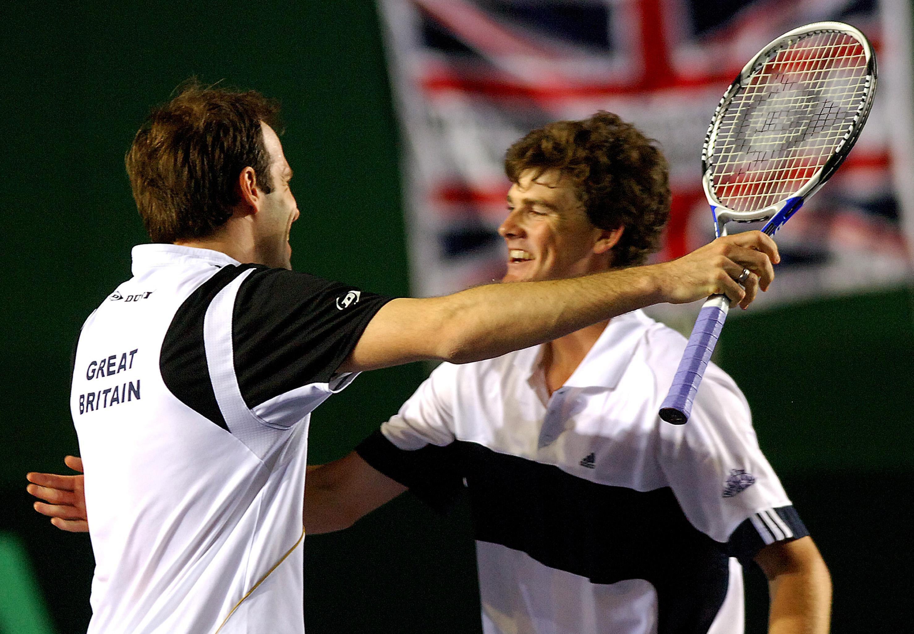 Rusedski, left, and Jamie Murray celebrate after beating Holland’s Robin Haase and Rogier Wassen at Birmingham’s NEC Arena (Rui Vieira/PA)