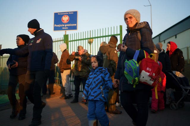 A family from Ukraine passes through the final gate to Poland after they crossed the border point from Ukraine into Medyka, Poland. File image (Victoria Jones/Pa)