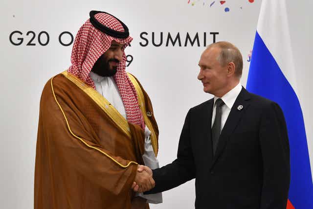 <p>Russian president Vladimir Putin (R) shakes hands with Saudi Arabia’s Crown Prince Mohammed bin Salman during a meeting on the sidelines of the G20 summit in Osaka, 29 June 2019</p>