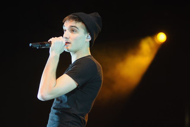 <p>Parker on stage with The Wanted in 2013 </p>