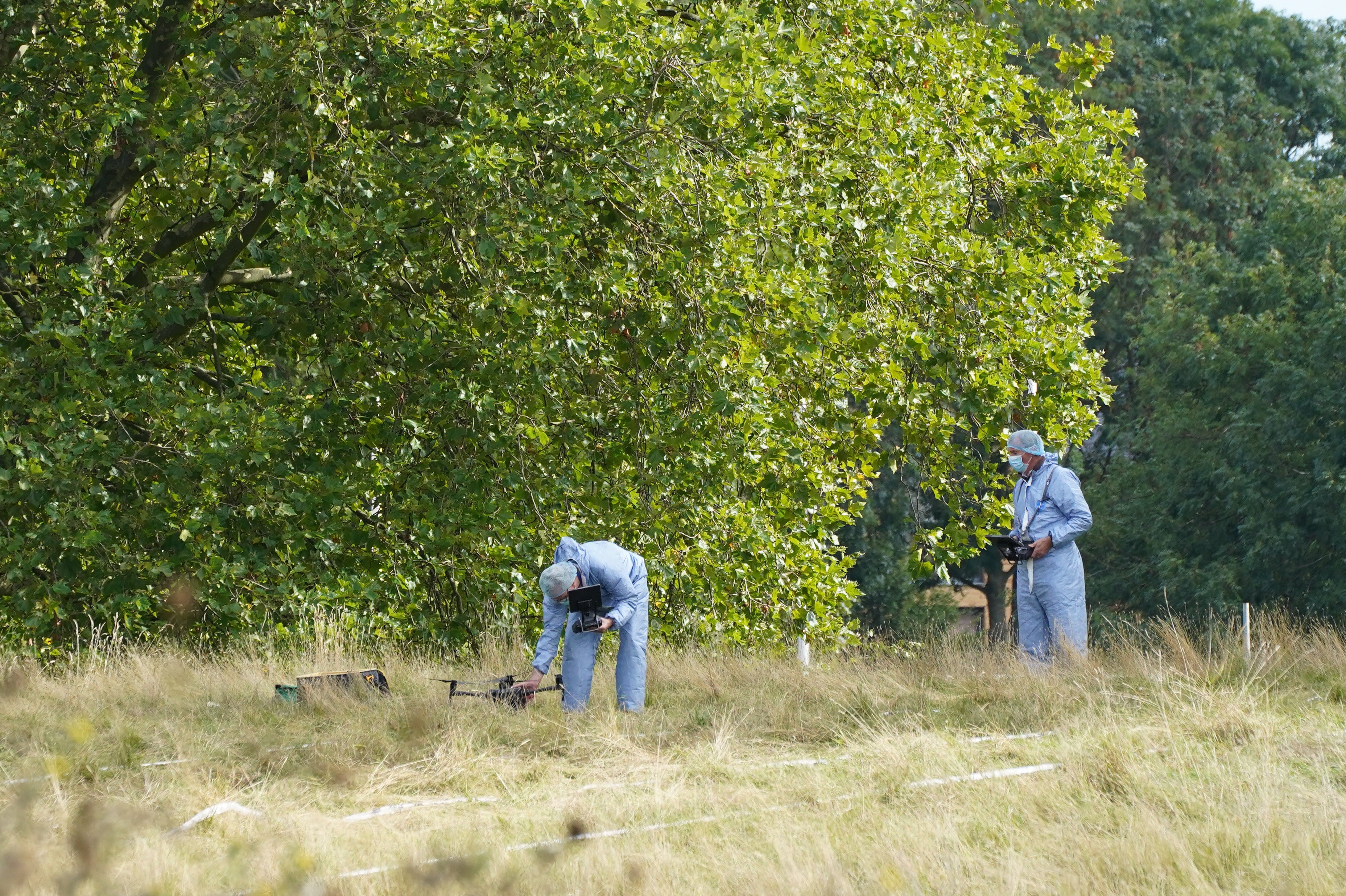 Forensic officers scour Cator Park in Kidbrooke, south-east London (Ian West/PA)
