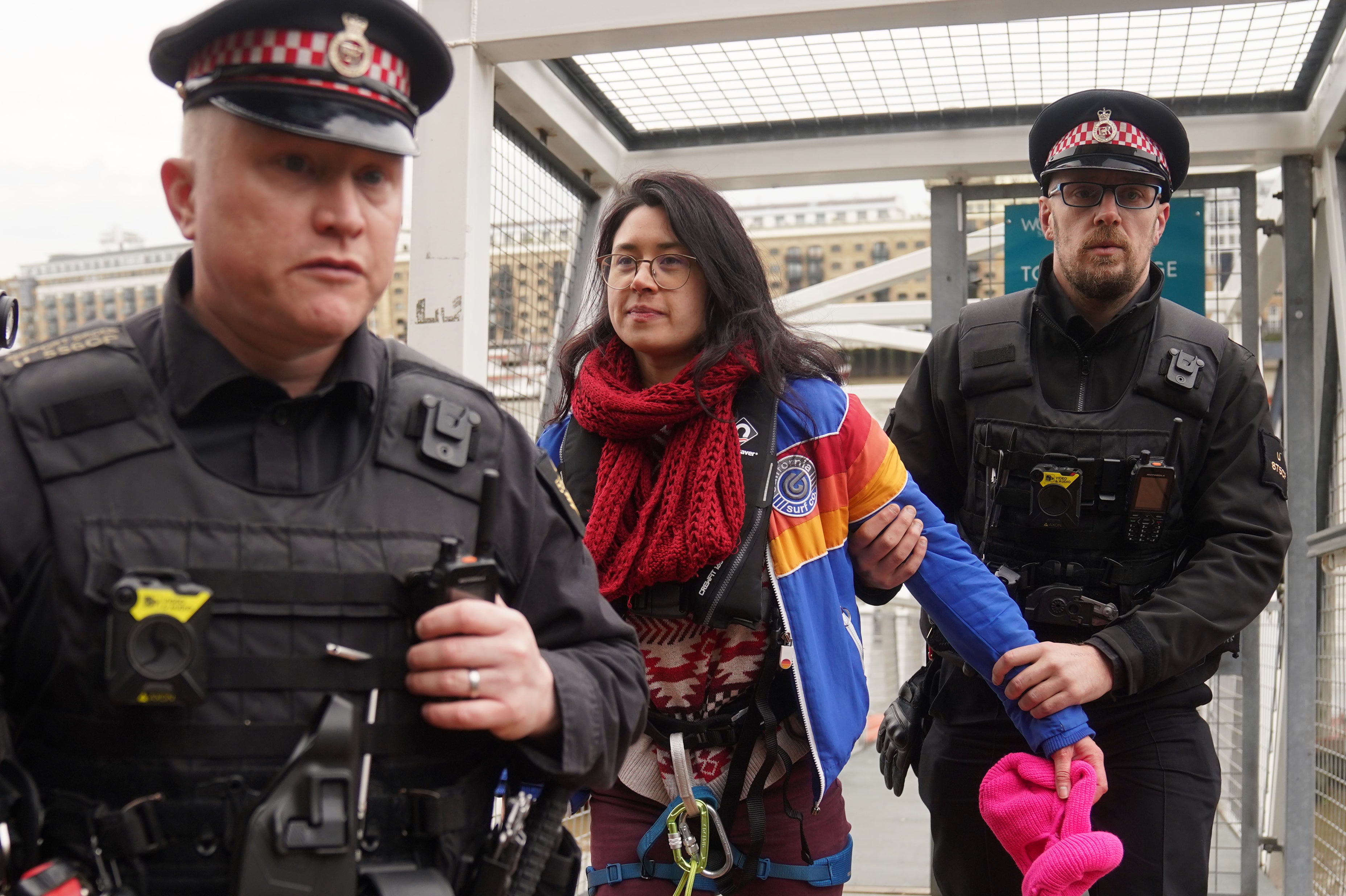 Police officers bring on shore Amy Rugg-Easey from Extinction Rebellion (Victoria Jones/PA)