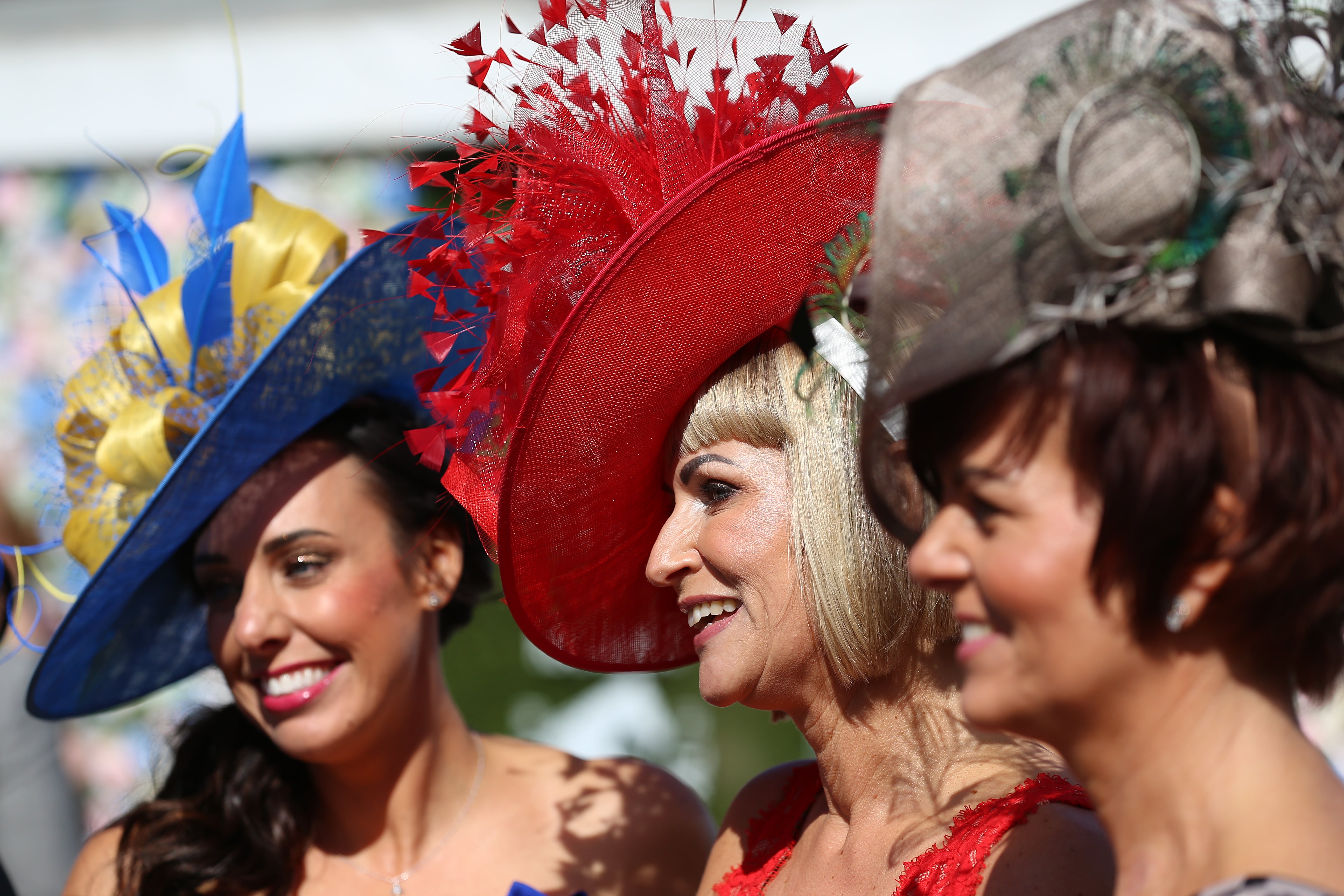 Claire Dixon, Tracey Allen and Rachael Sherwen at Aintree’s Ladies Day (Nigel French/PA)