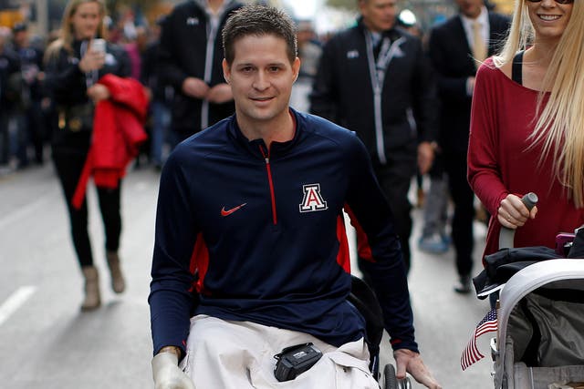 <p>Brian Kolfage taking in the Veterans Day parade in New York in 2014</p>