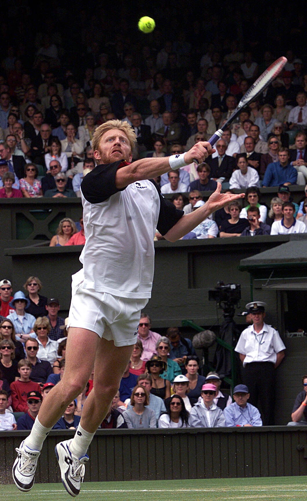 Becker in action against Patrick Rafter during the 1999 Wimbledon tennis Championships. Rafter defeated Becker 6-3 6-2 6-3 (PA)
