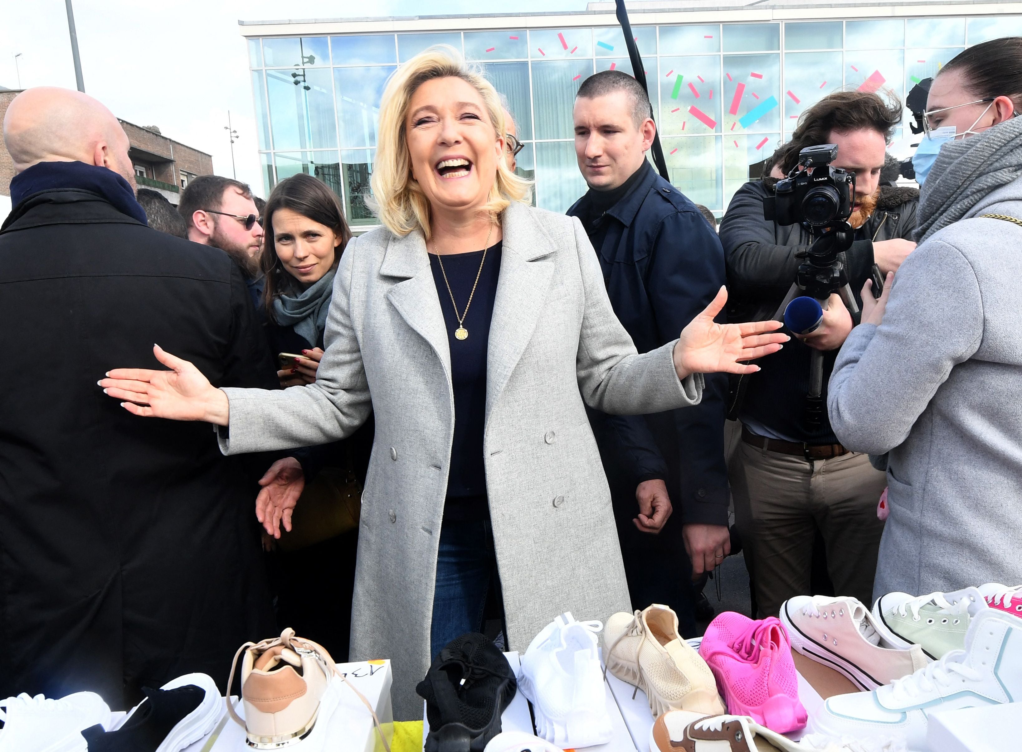 Marine Le Pen poses for a photo during a campaign visit to a market in Dunkirk, northern France, 12 March 2022