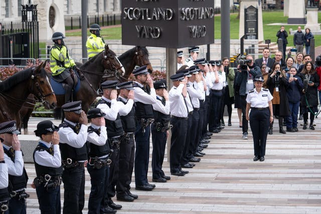 <p>Dame Cressida Dick outside Scotland Yard with an honour guard of officers to mark her departure </p>
