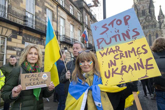 People take part in a demonstration outside the Russian consulate in Edinburgh following the Russian invasion (PA)